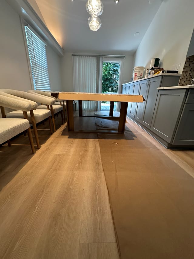 Dining table and chairs assembled in a finished interior