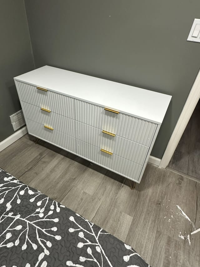 White and gold dresser assembled and placed