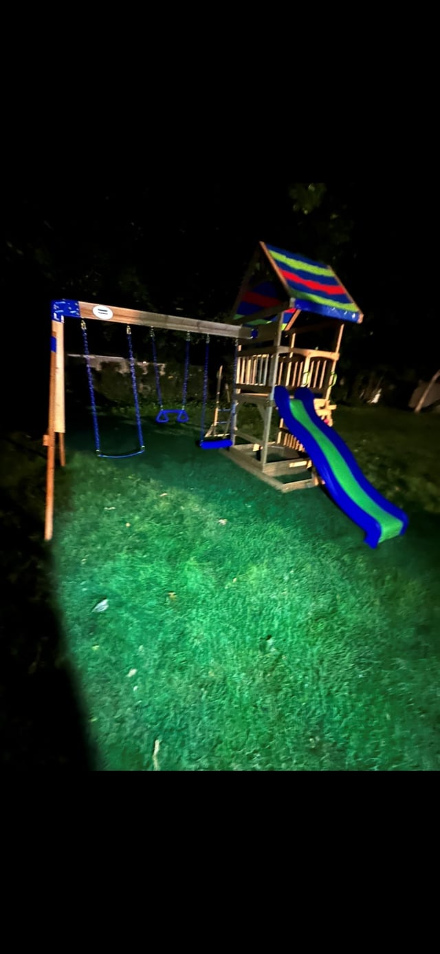 Wooden playset assembled and lit at night